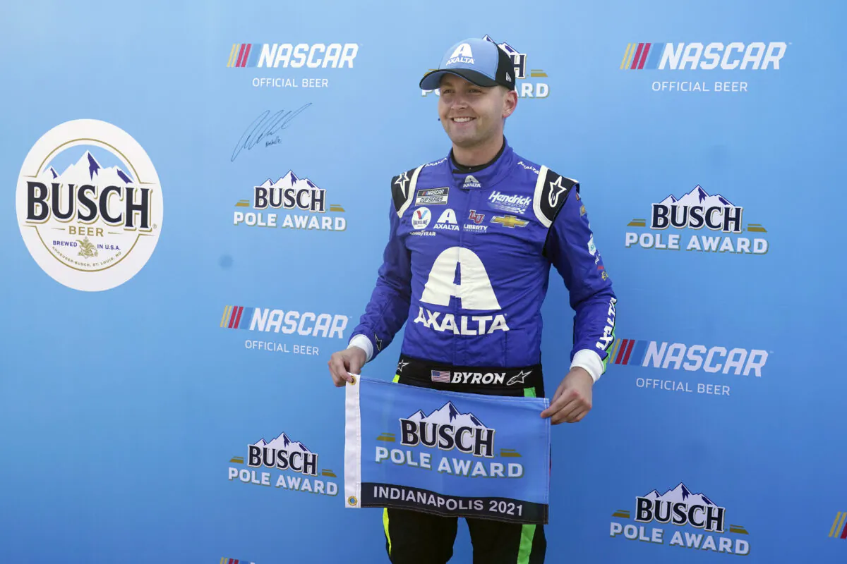 William Byron poses after winning the pole for the NASCAR Series auto race at Indianapolis Motor Speedway, in Indianapolis, on Aug. 15, 2021. (Darron Cummings/AP Photo)