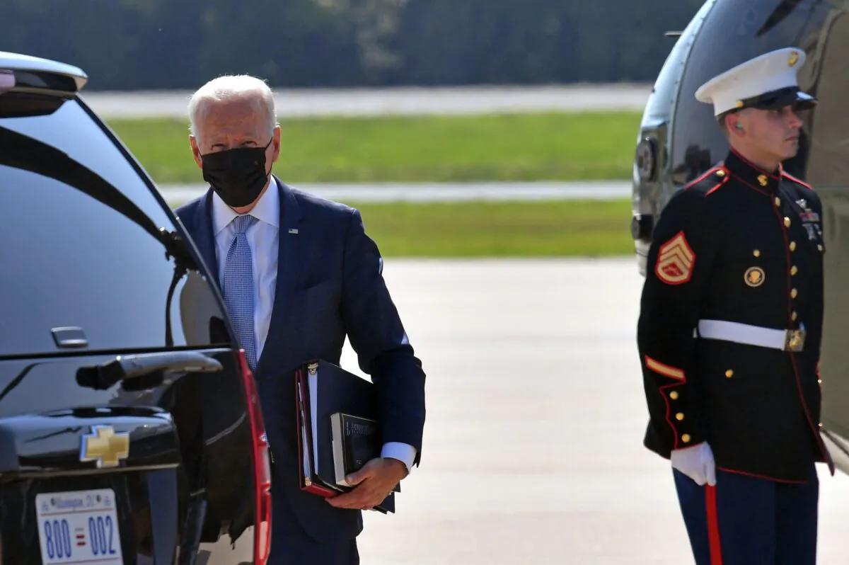 President Joe Biden steps off Marine One upon arrival at Delaware Air National Guard Base in New Castle, Del., on Aug. 12, 2021. (Nicholas Kamm/AFP via Getty Images)