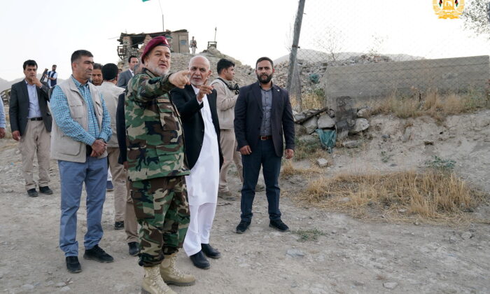 Afghanistan's President Ashraf Ghani and acting defence minister Bismillah Khan Mohammadi visit  military corps in Kabul, Afghanistan, on Aug. 14, 2021. (Afghan Presidential Palace/Handout via Reuters)