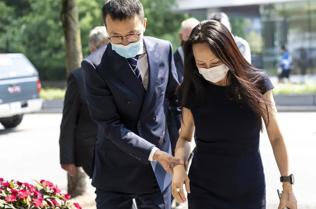 Meng Wanzhou, chief financial officer of Huawei, leaves for a lunch break during her extradition hearing at B.C. Supreme Court, in Vancouver, B.C., on Aug. 13, 2021. (The Canadian Press/Jimmy Jeong)