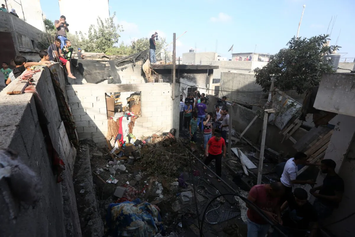Palestinians inspect the damage following an Israeli army operation overnight to arrest Palestinian Hamas leader Qaïs al-Saadi at his home in the Jenin refugee campin West Bank on Oct. 4, 2015. (JAAFAR ASHTIYEH/AFP via Getty Images)