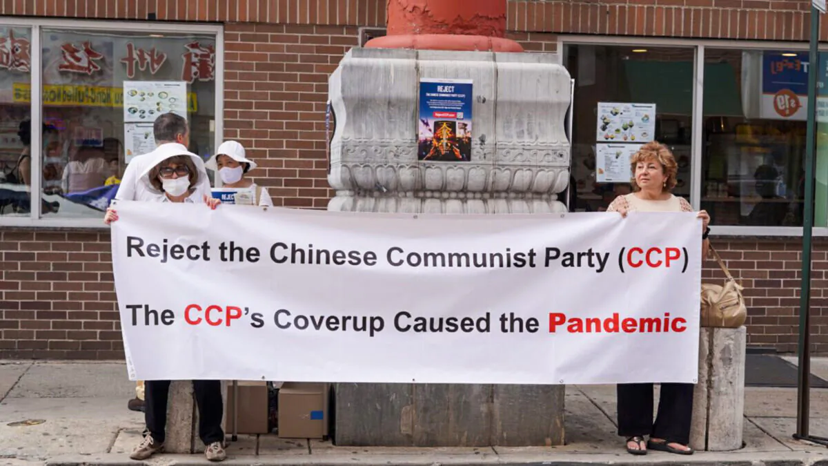 People rallied in Philadelphia Chinatown on Aug. 8, with a theme to expose communism's atrocities and raise awareness of the dangers of socialism and communism. (William Huang/The Epoch Times)
