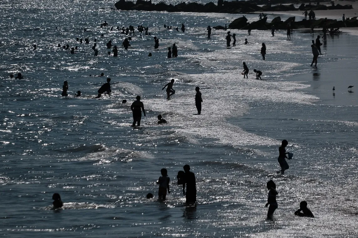 With a heat advisory in effect, people cool off at Coney Island beach in Brooklyn in New York City on June 28, 2021. (Spencer Platt/Getty Images)
