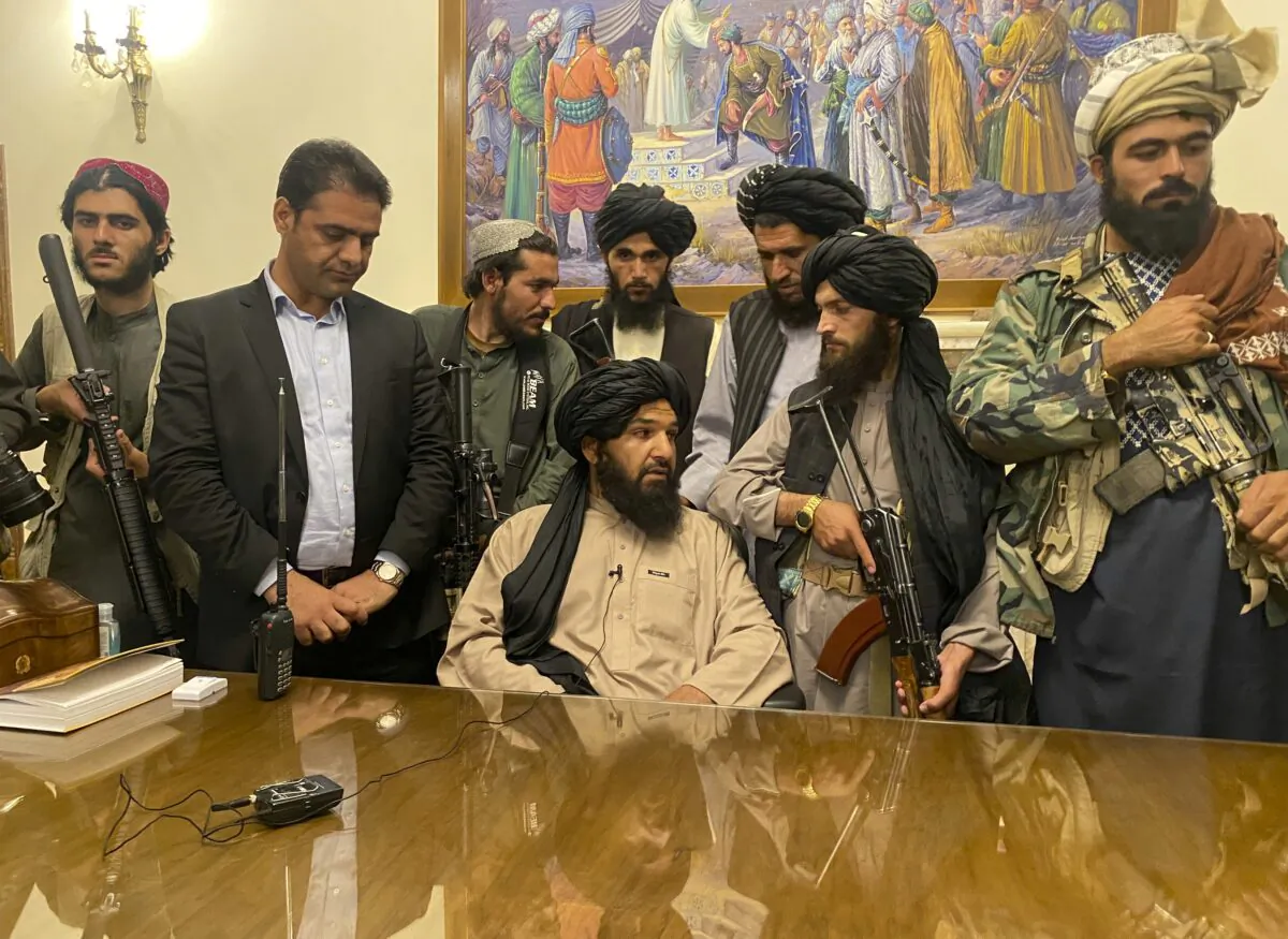 Taliban terrorists take control of Afghan presidential palace after the Afghan President Ashraf Ghani fled the country, in Kabul, Afghanistan, on Aug. 15, 2021. (Zabi Karimi/AP Photo)