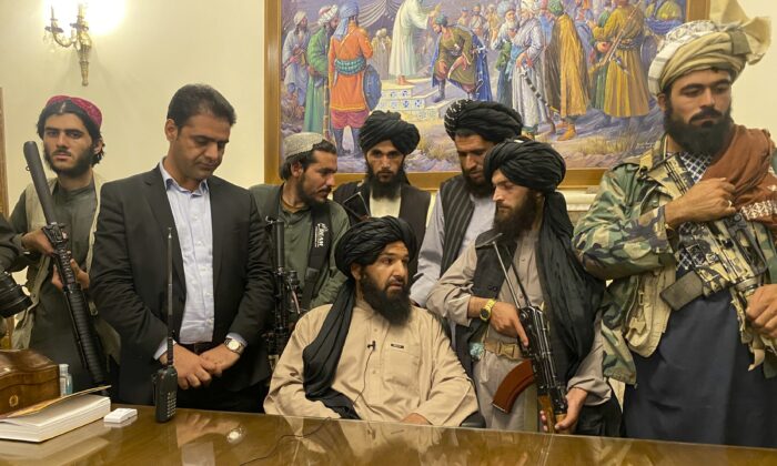 Taliban terrorists take control of Afghan presidential palace after the Afghan President Ashraf Ghani fled the country in Kabul, Afghanistan, on Aug. 15, 2021. (Zabi Karimi/AP Photo)