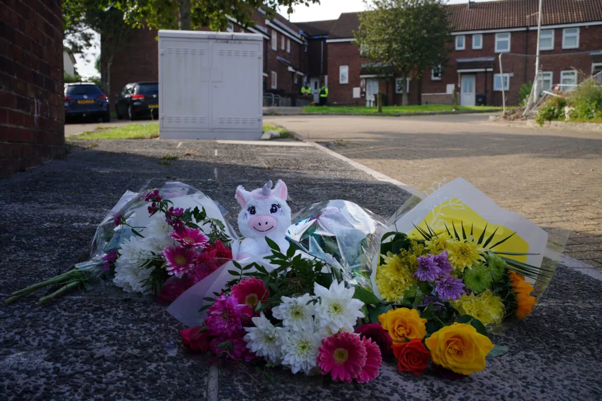 Floral tributes left in Biddick Drive, Keysham, where five people were killed by gunman Jake Davison, in Plymouth, UK, on Aug. 16, 2021. (Ben Birchall/PA)