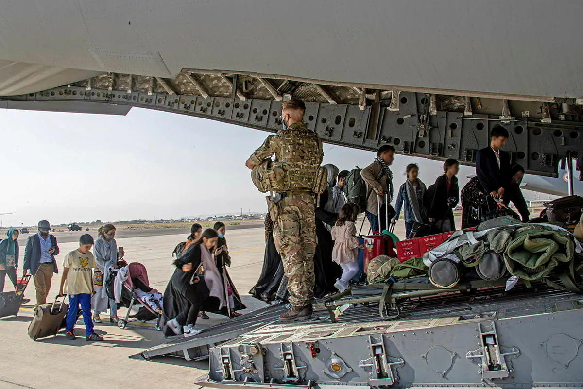 British citizens and dual nationals residing in Afghanistan board a military plane for evacuation from Kabul airport, Afghanistan, on Aug. 16, 2021.  (LPhot Ben Shread/UK MOD Crown copyright 2021/Handout via Reuters)