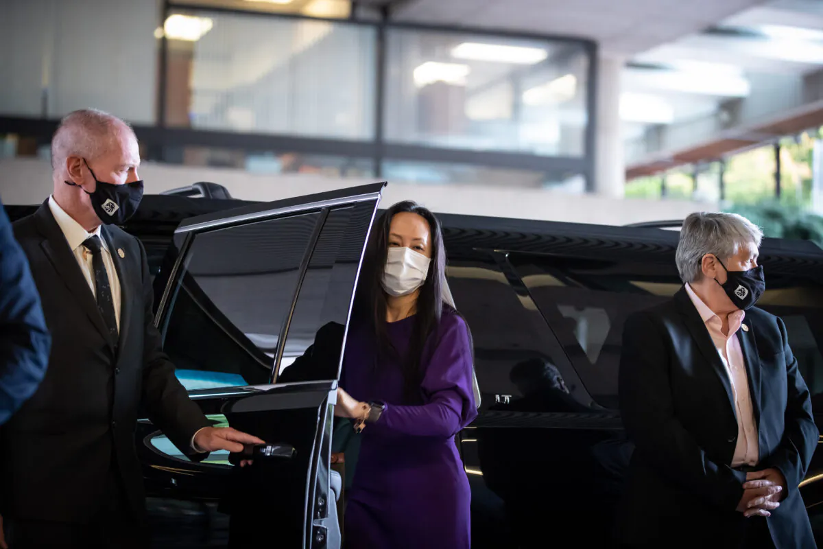 Meng Wanzhou, chief financial officer of Huawei, arrives at B.C. Supreme Court to attend what is expected to be the last day of her extradition hearing, in Vancouver, on Aug. 18, 2021. (The Canadian Press/Darryl Dyck)