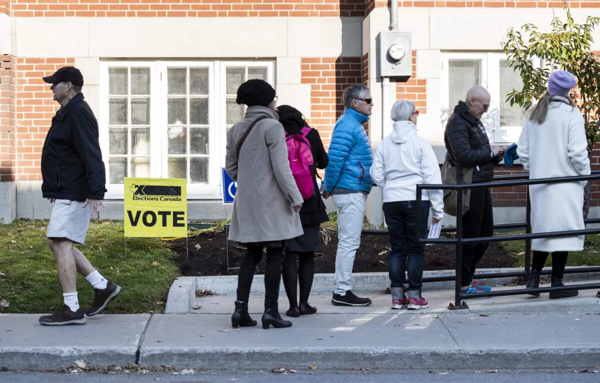 People line up to vote at a polling station in Ottawa during the 2019 federal election on Oct. 21, 2019. (The Canadian Press/Justin Tang)