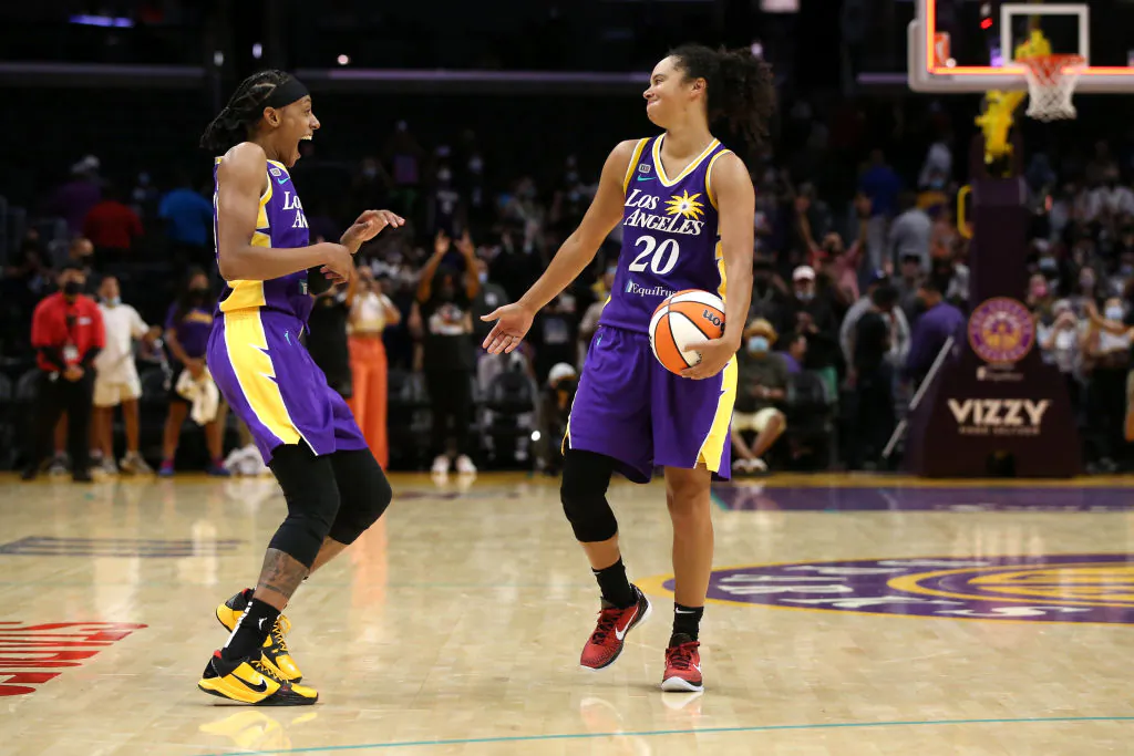 Brittney Sykes #15 and Kristi Toliver #20 of the Los Angeles Sparks celebrate after their 85-80 win in overtime against the Atlanta Dream at Staples Center Los Angeles on Aug. 17, 2021. (Katharine Lotze/Getty Images)