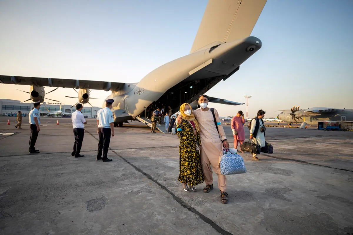 Evacuees from Afghanistan as they arrive in an Airbus A400 transport aircraft of the German Air Force Luftwaffe in Tashkent, Uzbekistan, on Aug. 17, 2021. (Marc Tessensohn/Twitter @Bw_Einsatz/Handout via Reuters)