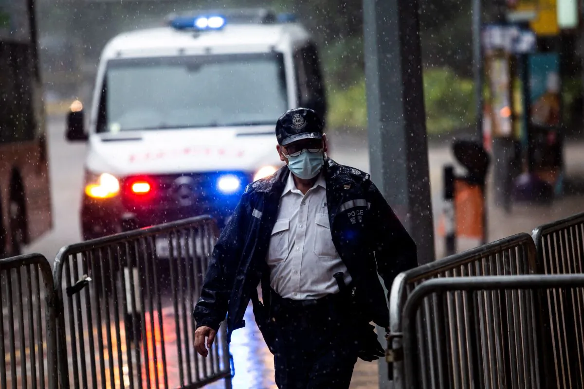 Police stand guard in Hong Kong on July 30, 2021. (Isaac Lawrence/AFP via Getty Images)