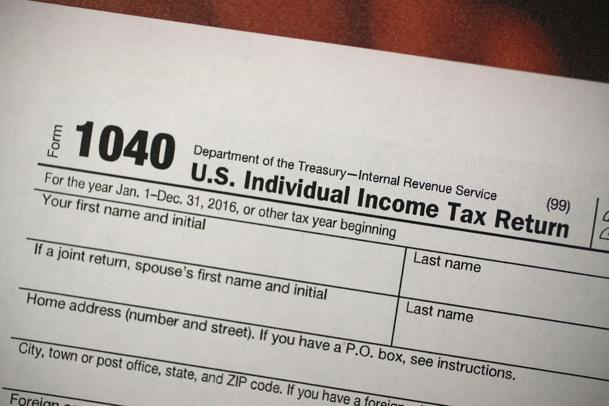 A copy of an IRS 1040 tax form is seen at an H&R Block office in Miami, Fla., on Dec. 22, 2017. (Joe Raedle/Getty Images)