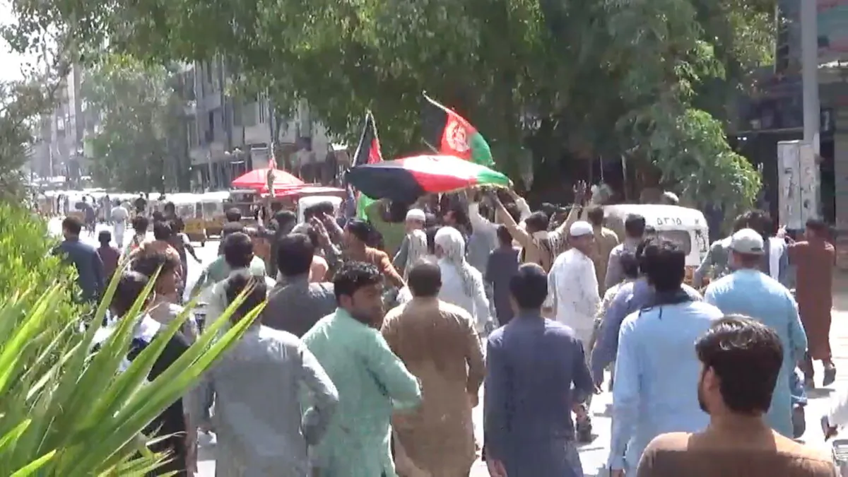 People carry Afghan flags as they take part in an anti-Taliban protest in Jalalabad, Afghanistan, on Aug. 18, 2021 in this screen grab taken from a video. (Pajhwok Afghan News/Handout via Reuters)