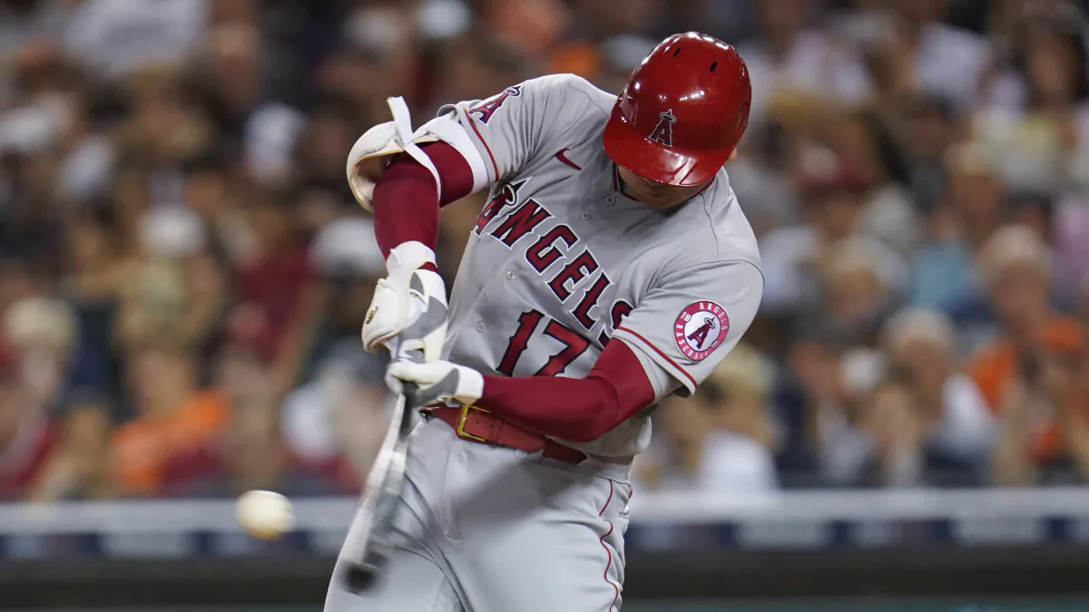 Los Angeles Angels' Shohei Ohtani hits a solo home run against the Detroit Tigers in the eighth inning of a baseball game in Detroit on Aug. 18, 2021. (AP Photo/Paul Sancya)