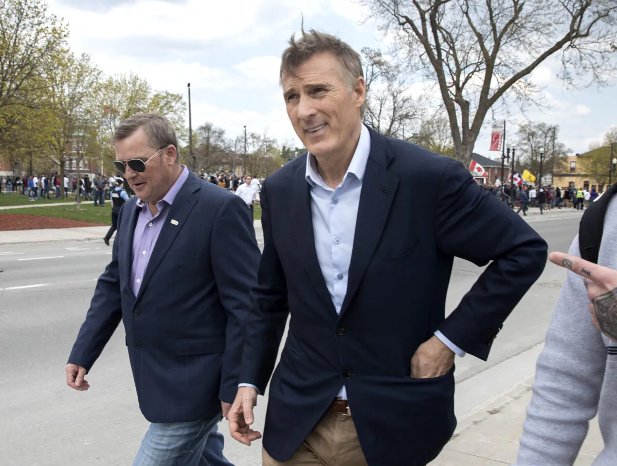 People's Party of Canada Leader Maxime Bernier leaves a protest against government measures to curb the spread of COVID-19, in Peterborough, Ont., on April 24, 2021. (The Canadian Press/Fred Thornhill)