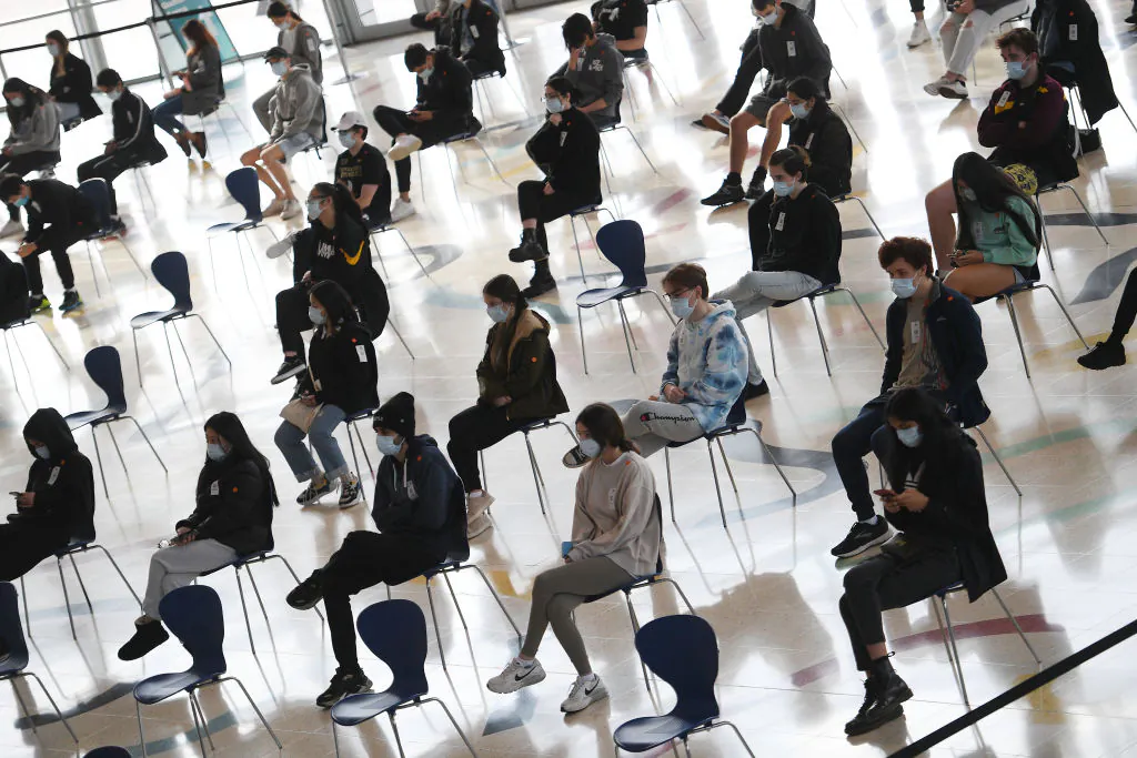 Students wait to receive the Pfizer vaccine for COVID-19 at Qudos Arena, in Sydney, Australia, on Aug. 9, 2021( Dean Lewins-Pool/Getty Images)