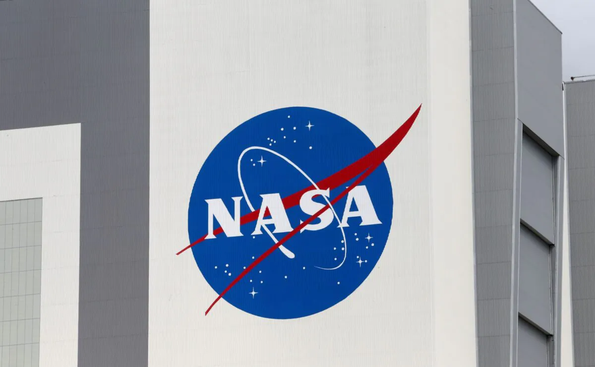 The NASA logo is seen at Kennedy Space Center ahead of the NASA/SpaceX launch of a commercial crew mission to the International Space Station in Cape Canaveral, Fla., on April 16, 2021. (Joe Skipper/NASA)