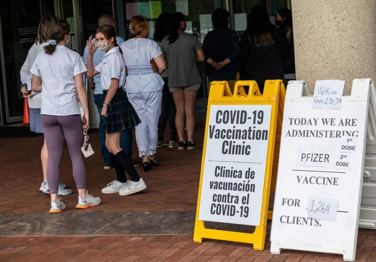 People arrive to receive COVID-19 vaccinations at the Fairfax Government Center vaccination clinic in Fairfax, Va., on May 13, 2021. (Andrew Caballero-Reynolds/AFP via Getty Images)
