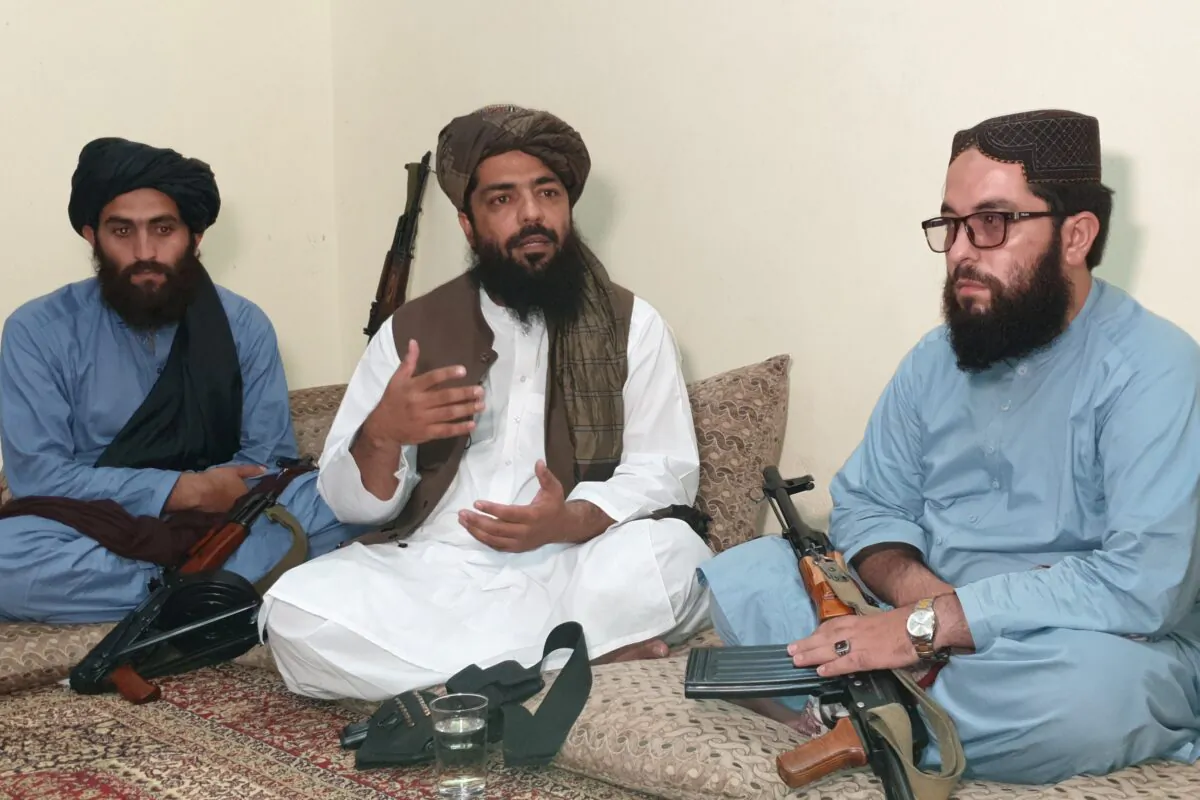 Waheedullah Hashimi (C), a senior Taliban commander, gestures as he speaks with Reuters during an interview at an undisclosed location near the Afghanistan–Pakistan border on Aug. 17, 2021. (Stringer/Reuters)