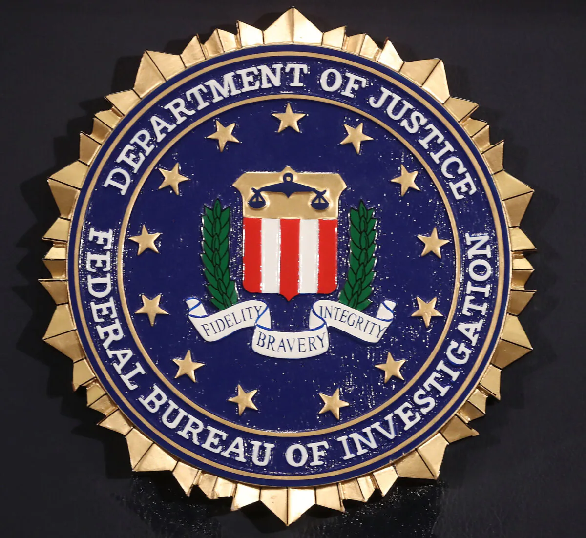 The FBI seal is attached to a podium at a news conference at FBI Headquarters in Washington on June 14, 2018. (Mark Wilson/Getty Images)