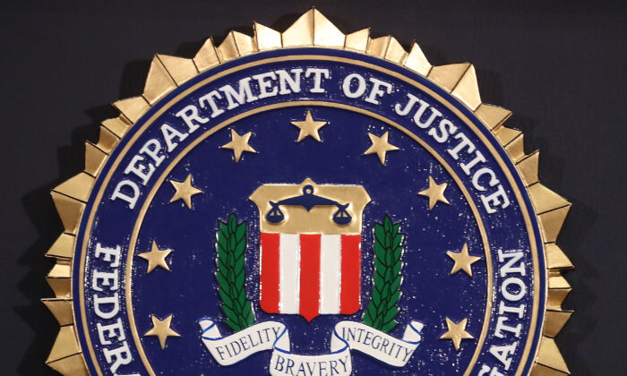 The FBI seal is attached to a podium at a news conference at FBI Headquarters in Washington on June 14, 2018. (Mark Wilson/Getty Images)