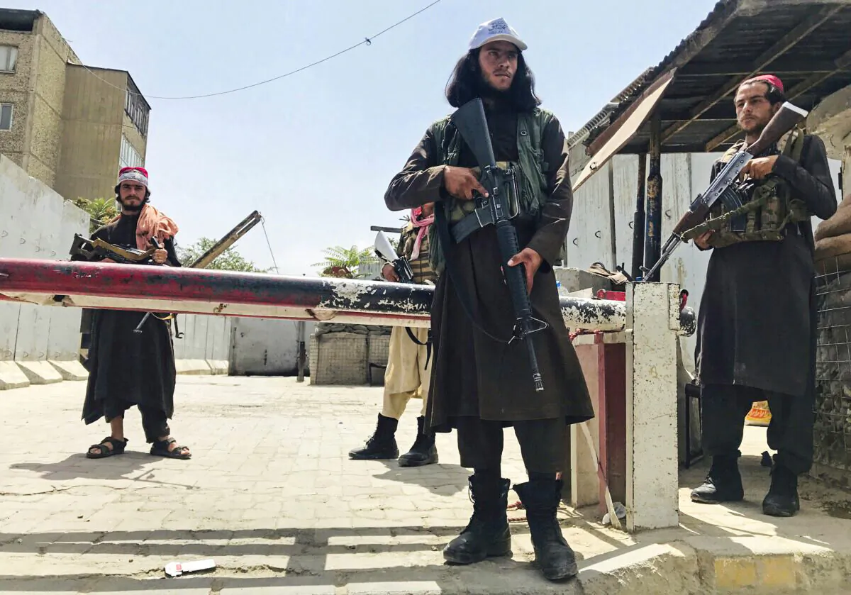 Taliban fighters stand guard at a checkpoint near the U.S. Embassy that was previously manned by U.S. troops in Kabul, Afghanistan, on Aug. 17, 2021. (AP Photo)