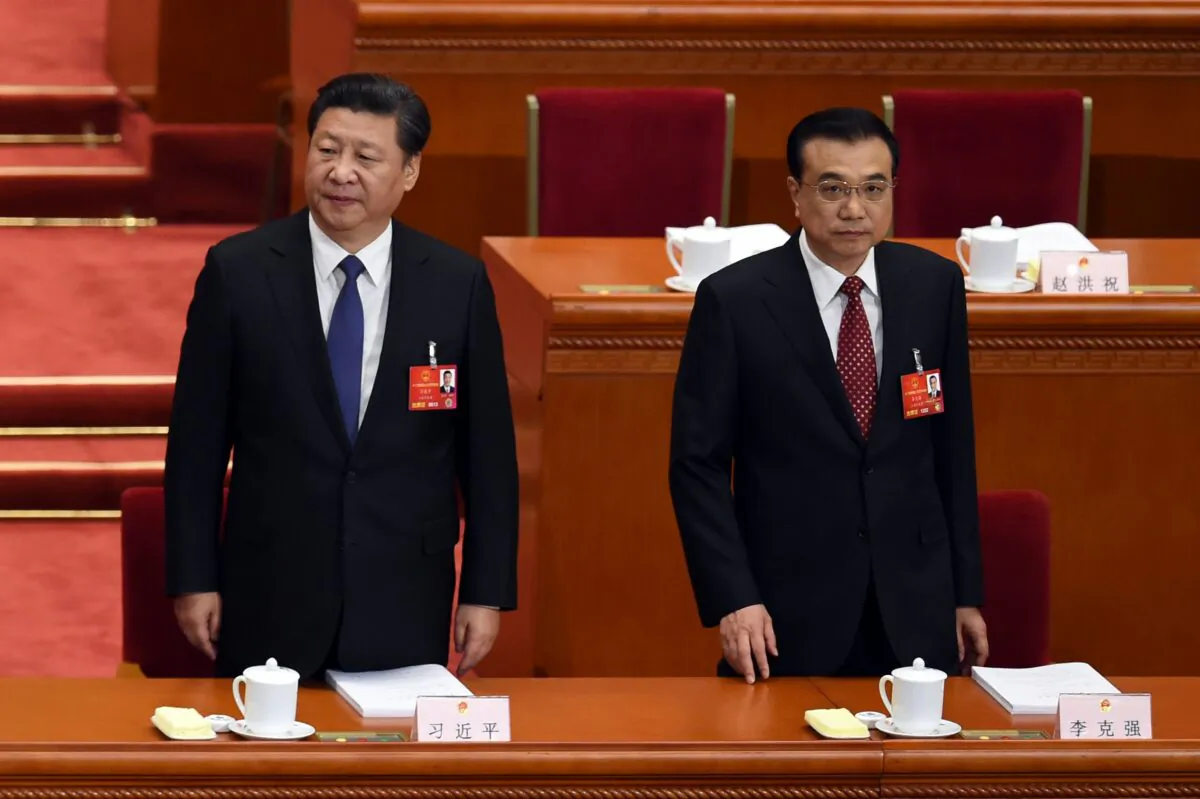 Chinese leader Xi Jinping (L) and Premier Li Keqiang arrive for the opening ceremony of the rubber-stamp legislature’s congress in Beijing on March 5, 2016. (Wang Zhao/AFP via Getty Images)