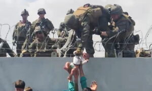 Baby Passed Over Wall at Afghanistan Airport Has Been Reunited With Family, US Says