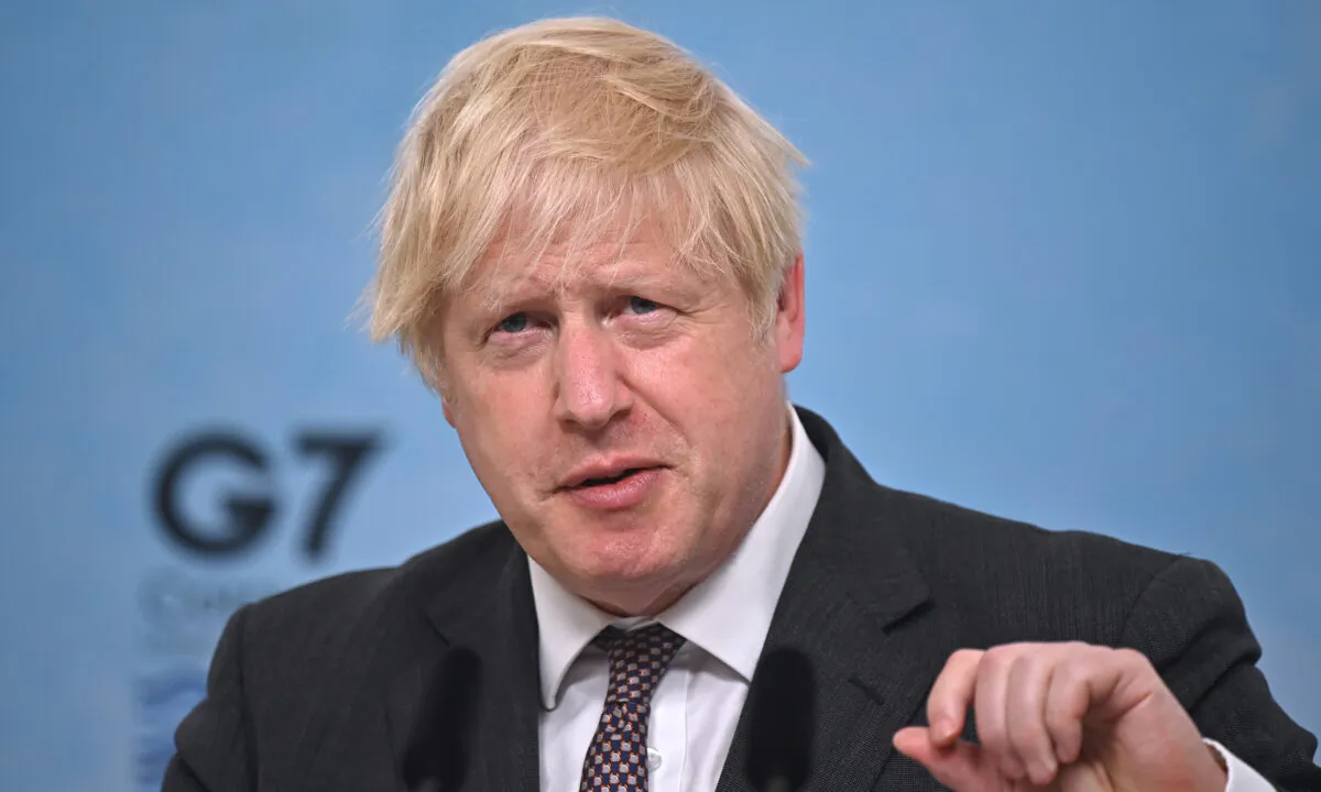 British Prime Minister Boris Johnson takes part in a press conference on the final day of the G-7 summit in Cornwall, United Kingdom, on June 13, 2021. (Ben Stansall/WPA Pool/Getty Images)