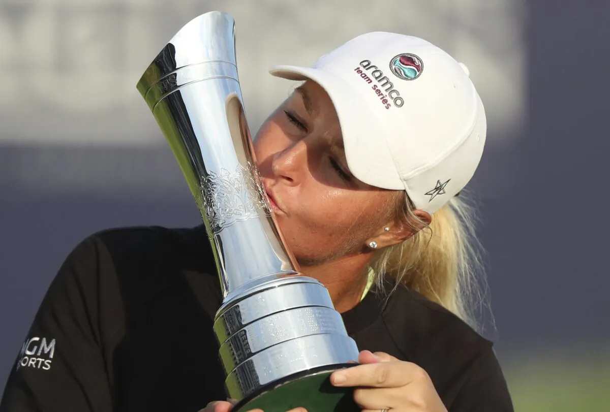 Sweden's Anna Nordqvist kisses the trophy as she poses for the media after winning the Women's British Open golf championship, in Carnoustie, Scotland, on Aug. 22, 2021. (Scott Heppell/AP Photo)