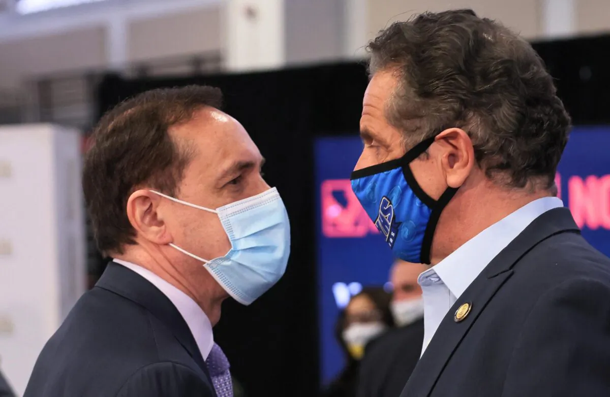 Howard Zucker, commissioner of the New York State Department of Health, and Gov. Andrew Cuomo after a press conference on COVID-19 vaccination at Suffolk County Community College in Brentwood, N.Y., on April 12, 2021. (Michael M. Santiago/Pool/AFP via Getty Images)