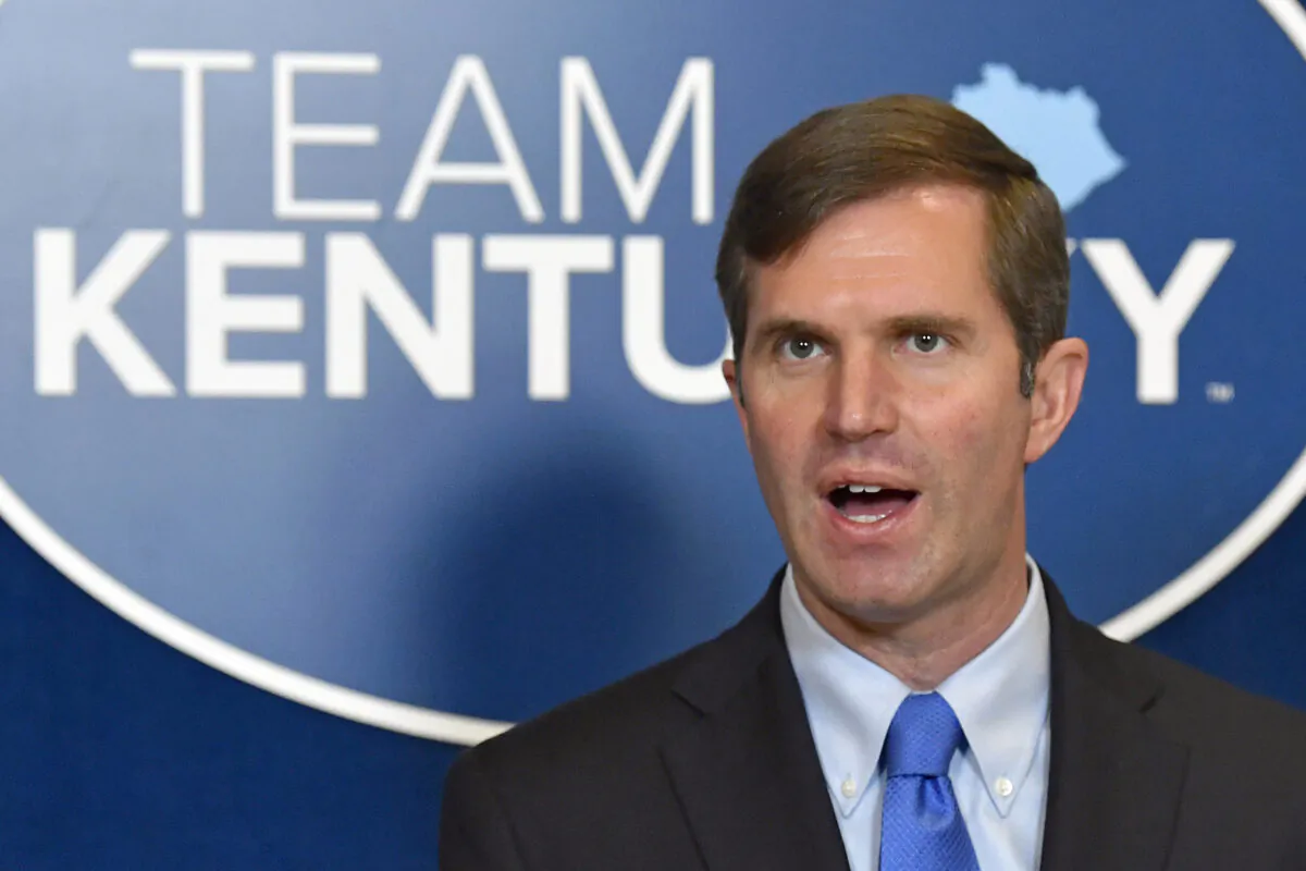 Kentucky Gov. Andy Beshear speaks to reporters at the Kentucky State Capitol in Frankfort on April 7, 2021. (Timothy D. Easley/AP Photo)