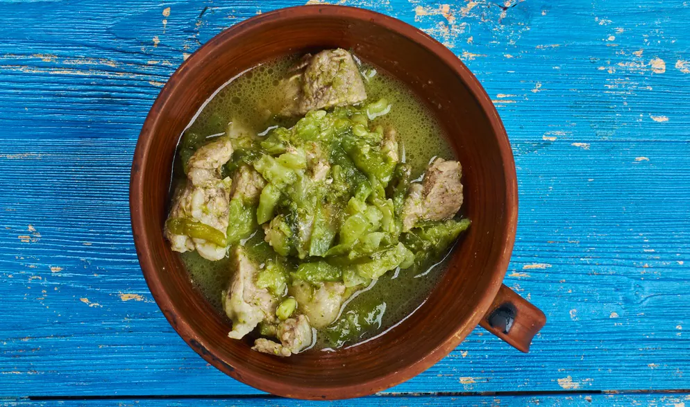 Roasted green chiles are the star of this iconic New Mexico stew. (Fanfo/Shutterstock)