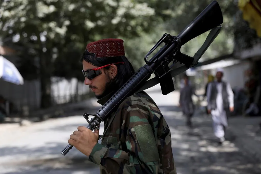 A Taliban fighter stands guard at a checkpoint in the Wazir Akbar Khan neighborhood in the city of Kabul, Afghanistan, on Aug. 22, 2021. (AP Photo/Rahmat Gul)