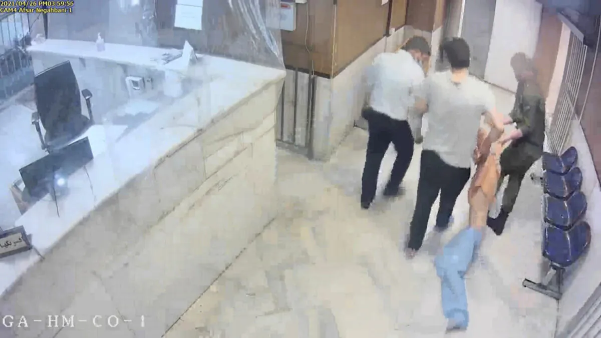 In this undated frame grab taken from video shared with The Associated Press by a self-identified hacker group called "The Justice of Ali," guards drag an emaciated prisoner, at Evin prison in Tehran, Iran (The Justice of Ali via AP)