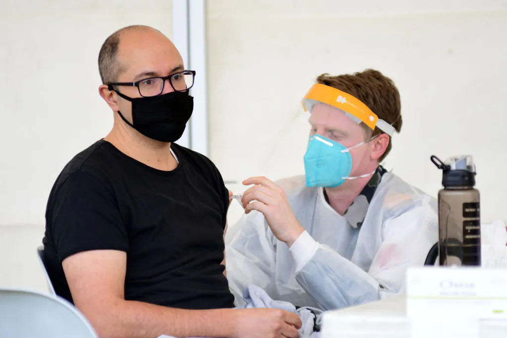 A man receives a dose of a COVID-19 vaccine at a newly opened vaccination hub in Dubbo, Australia, on Aug. 21, 2021. (Belinda Soole/Getty Images)