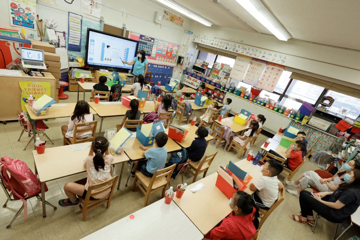 A teacher with summer program students are seen on a monitor at Yung Wing School P.S. 124, in New York City, on July 22, 2021. (Michael Loccisano/Getty Images)