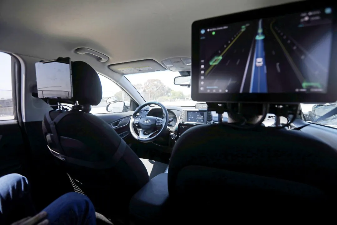 An empty driver's seat is seen inside a vehicle equipped with Pony.ai's self-driving technology during a demonstration in Fremont, Calif., on June 17, 2021. (Nathan Frandino/Reuters)