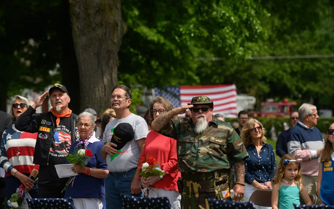 Veterans salute during the singing of the National Anthem in the Oakmont-Verona Cemetery during a memorial service at the 2021 Oakmont-Verona Memorial Day Parade in Oakmont, Penn. on May 31, 2021. (Jeff Swensen/Getty Images)