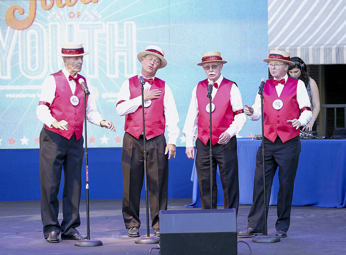 A barbershop quartet perform on July 27, 2013 in Universal City, California. (Imeh Akpanudosen/Getty Images for Variety)