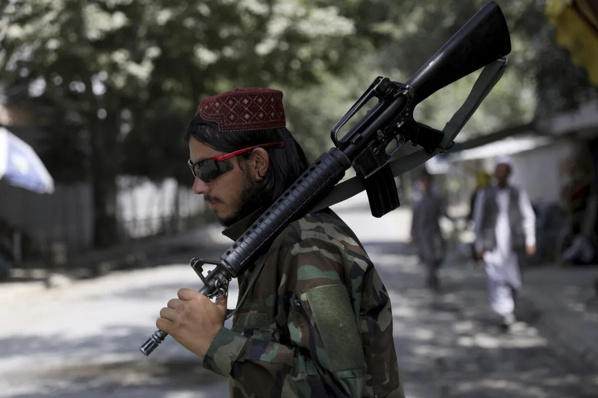A Taliban fighter stands guard at a checkpoint in the Wazir Akbar Khan neighborhood in the city of Kabul, Afghanistan, on Aug. 22, 2021. (Rahmat Gul/AP Photo)