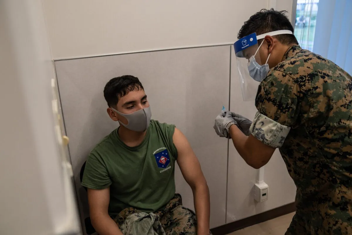 A United States Marine receives the Moderna COVID-19 vaccine at Camp Foster in Kin, Japan on April 28, 2021. (Carl Court/Getty Images)