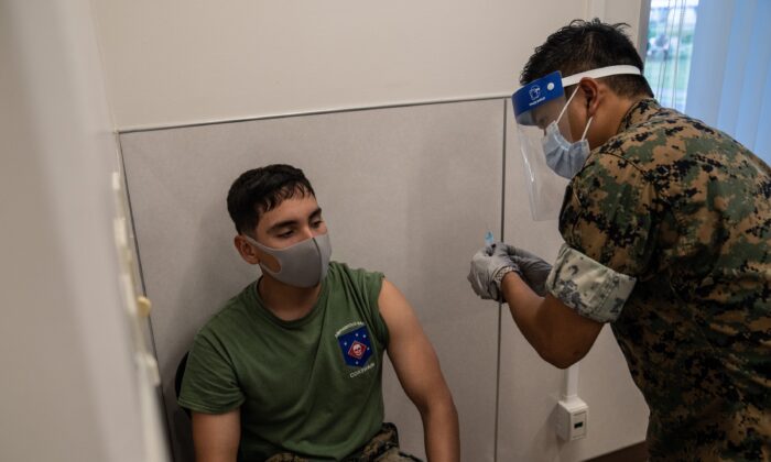 A United States Marine receives the Moderna COVID-19 vaccine at Camp Foster in Kin, Japan on April 28, 2021. (Carl Court/Getty Images)