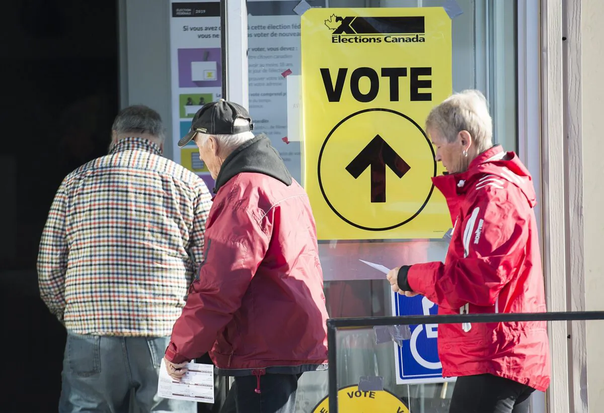 People arrive to cast their ballots at a polling station in Shawinigan, Que., in the last federal election on Oct. 21, 2019. (The Canadian Press/Graham Hughes)