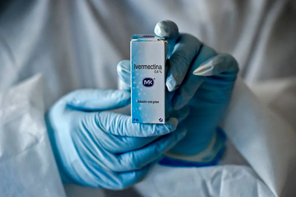 A health worker shows a box containing a bottle of Ivermectin, a medicine authorized by the National Institute for Food and Drug Surveillance to treat patients with mild, asymptomatic or suspicious COVID-19, as part of a study of the Center for Paediatric Infectious Diseases Studies, in Cali, Colombia, on July 21, 2020. (Photo by Luis ROBAYO / AFP) (Photo by LUIS ROBAYO/AFP via Getty Images)