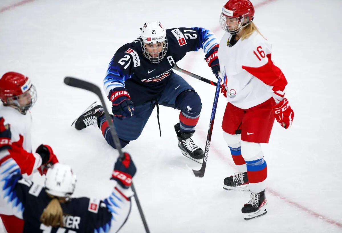 Hilary Knight of the United States (L) celebrates her goal as Russia's Ilona Markova looks on during second period IIHF Women's World Championship hockey action in Calgary, Alberta, Canada, on Aug. 24, 2021. (Jeff McIntosh/The Canadian Press via AP)