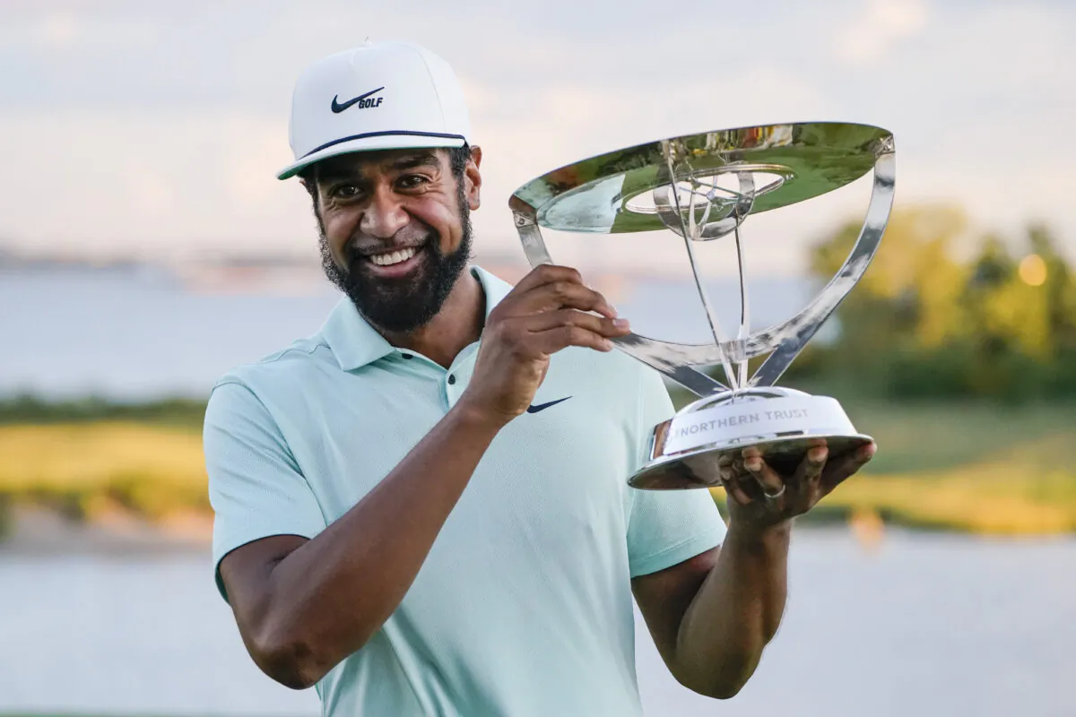 Tony Finau poses with the Wanamaker Trophy after winning The Northern Trust golf tournament at Liberty National Golf Course in Jersey City, N.J., on Aug. 23, 2021. (John Minchillo/AP Photo)