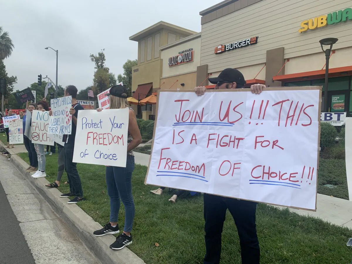 California’s frontline health care workers hold simultaneous protests against the government's mandatory vaccination order at Kaiser Permanente-Riverside Medical Center in Riverside, Calif., on Aug. 21, 2021. (Linda Jiang/The Epoch Times)