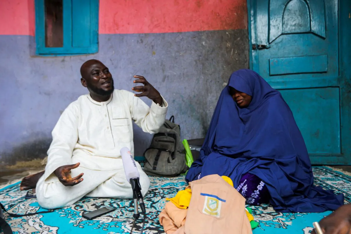 Abubakar Adam and his wife, parents of seven children kidnapped at Salihu Tanko Islamic school by bandits, speak during an interview with Reuters at their house in Tegina, Niger State, Nigeria, on Aug. 11, 2021. (Afolabi Sotunde/Reuters)